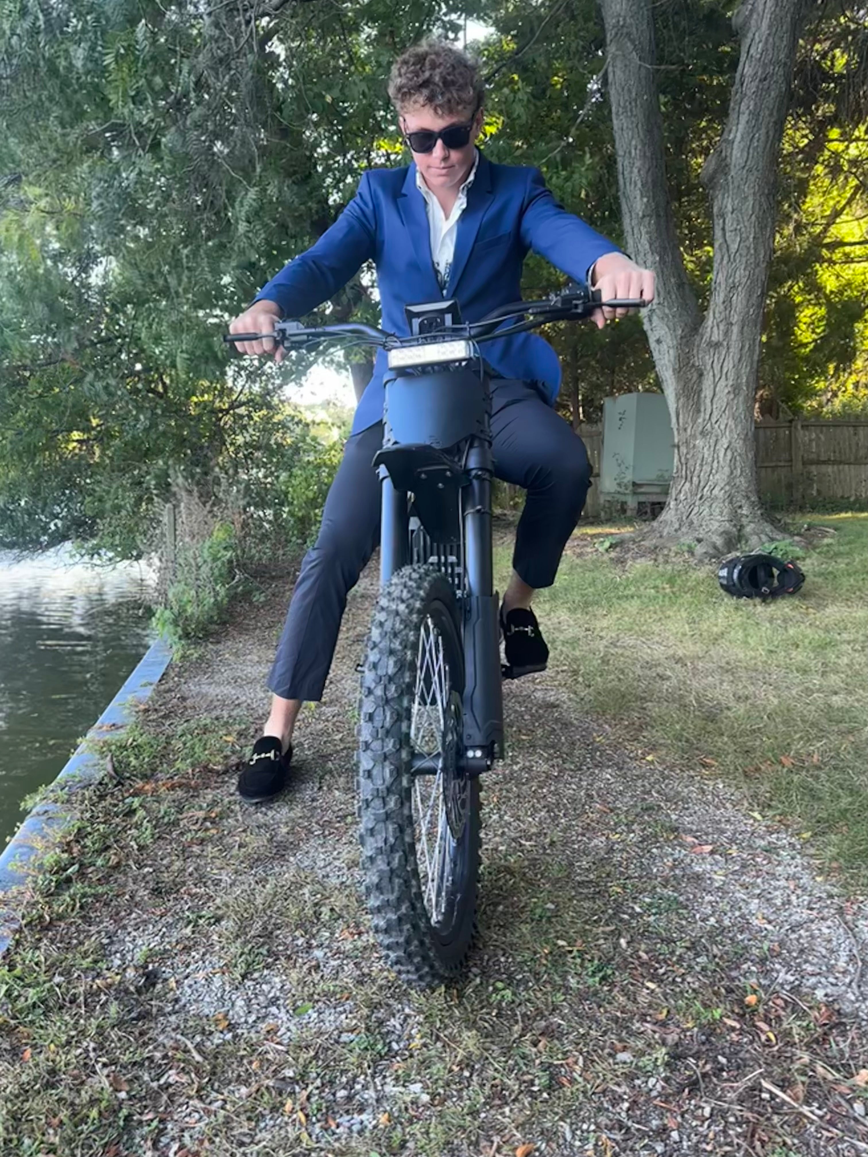 Wealthy man riding E Ride Pro SS 2.0 Electric Bike