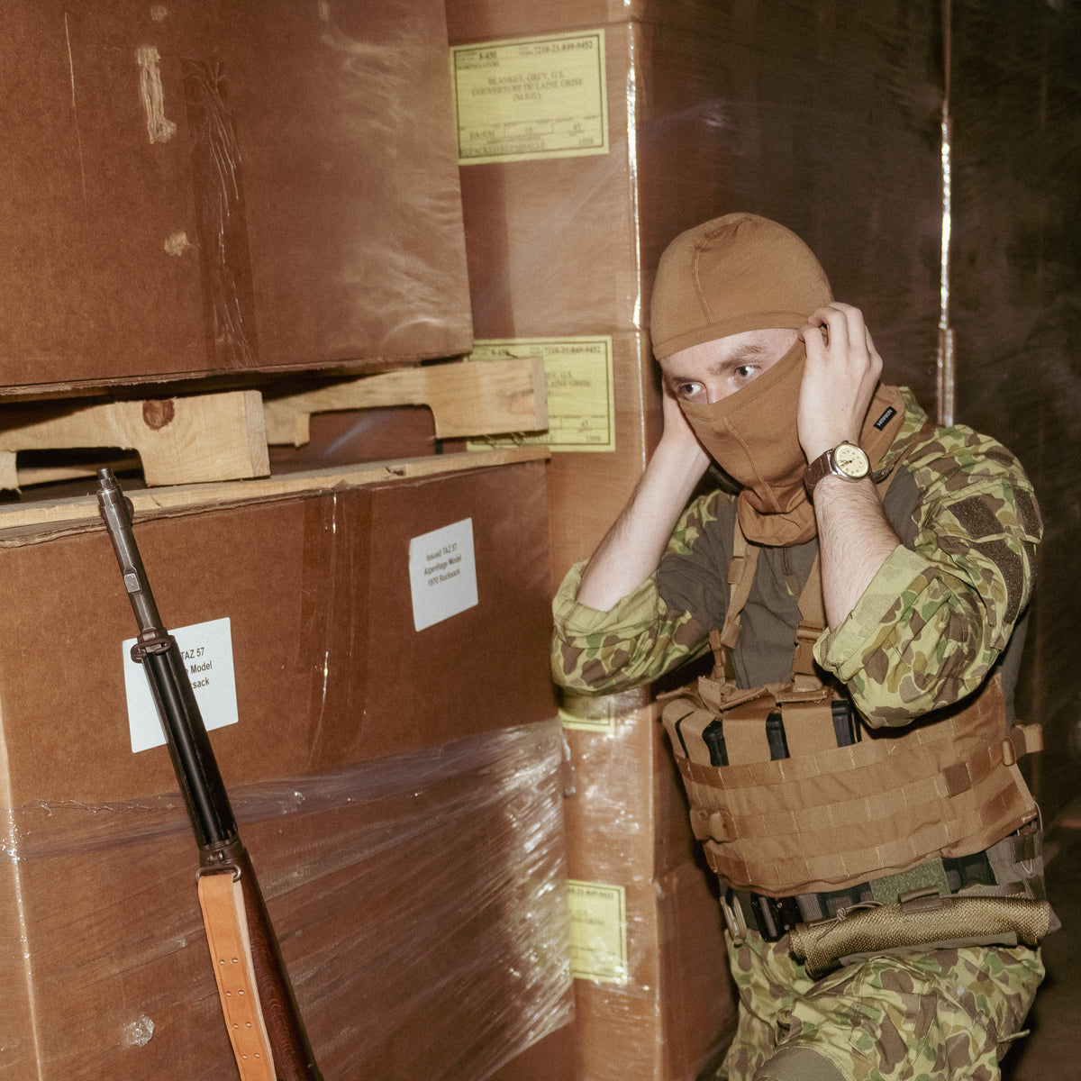 Man in balaclava wearing USMC TAP Chest Rig