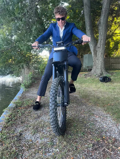 Wealthy man riding E Ride Pro SS 2.0 Electric Bike
