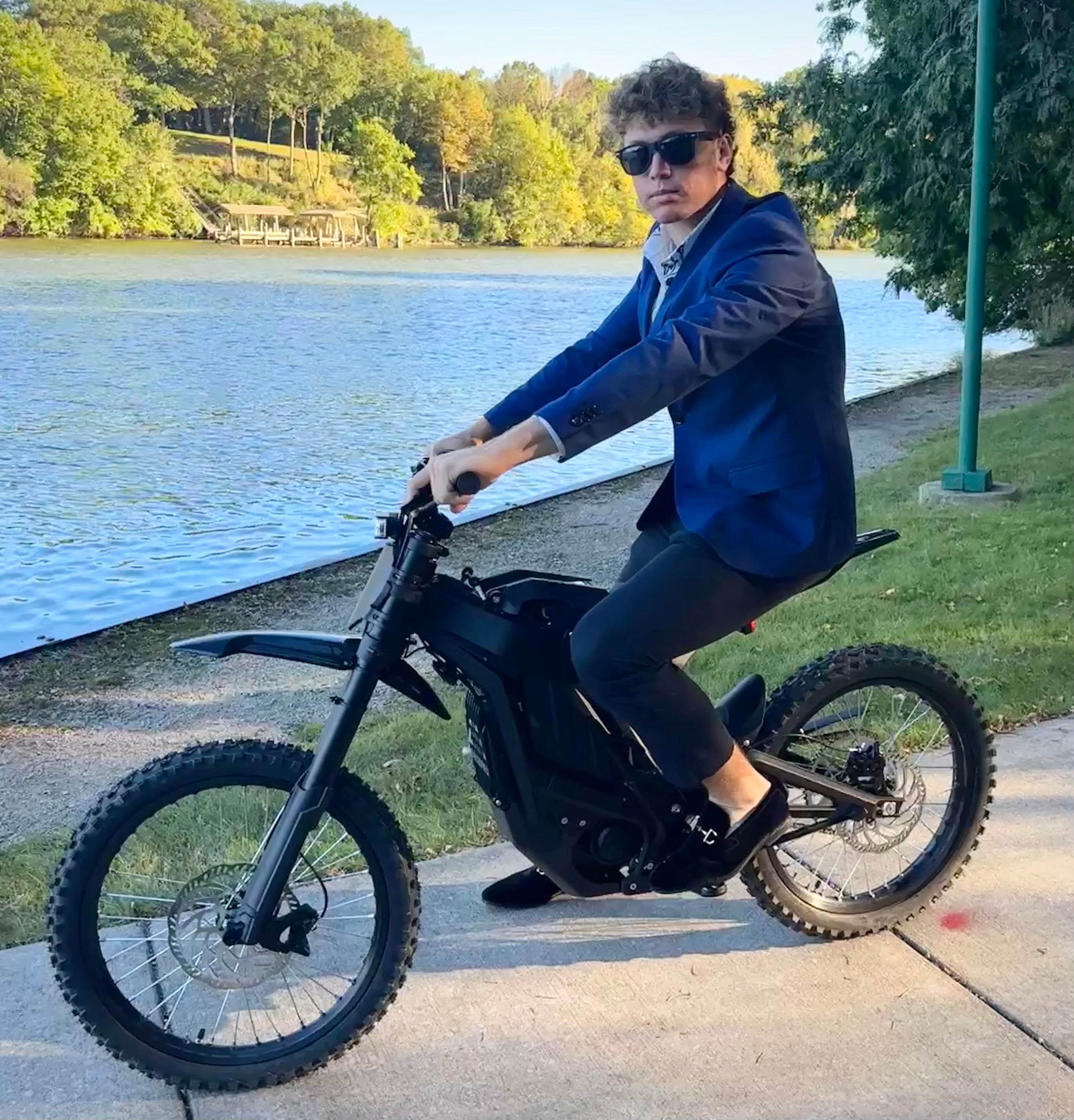 Wealthy man riding E Ride Pro SS 2.0 Electric Bike
