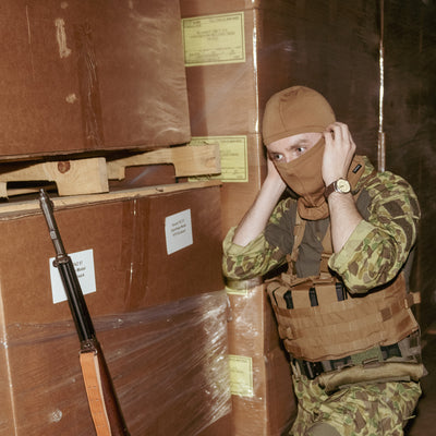 Man in balaclava wearing USMC TAP Chest Rig