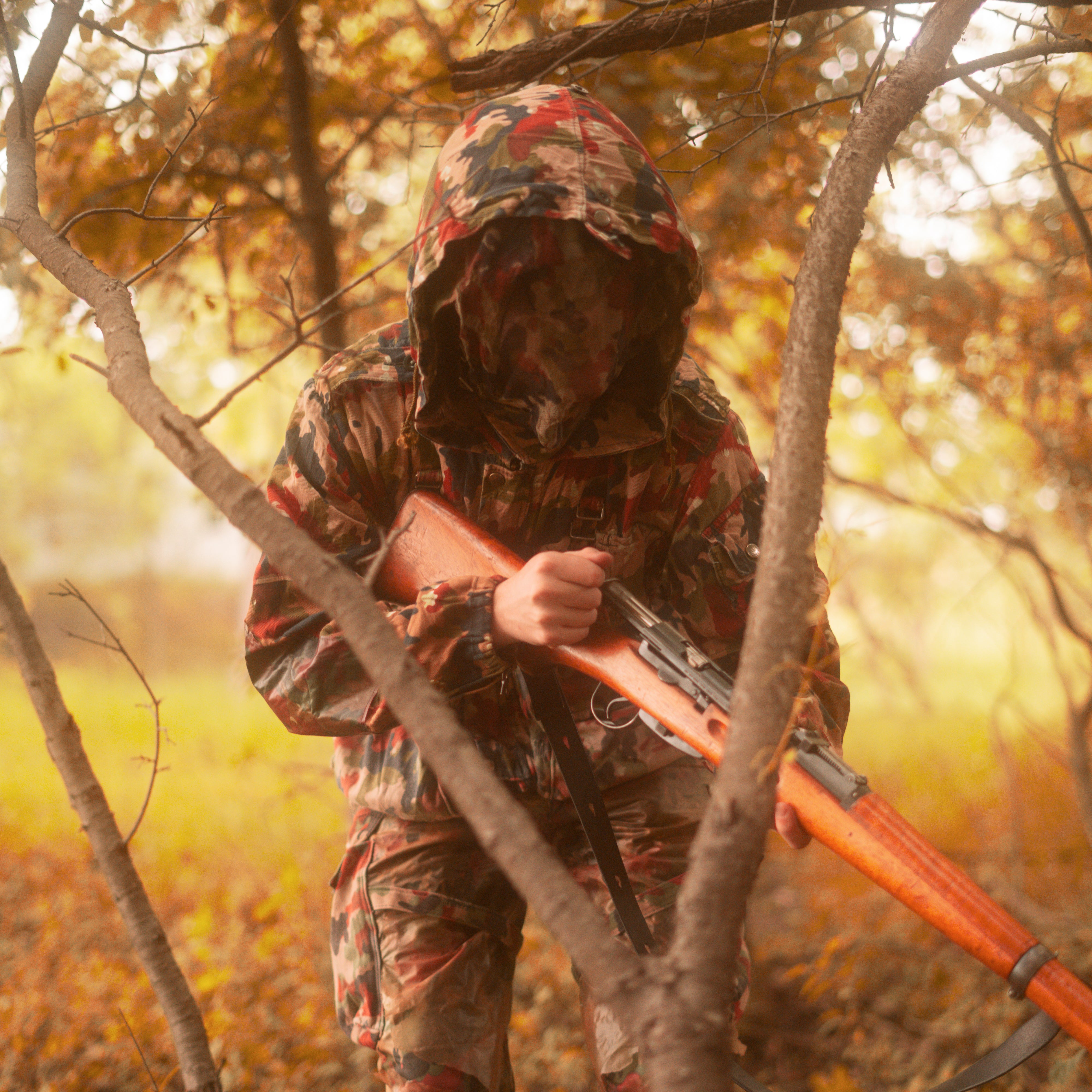 Masked soldier wearing TAZ 57 Alpenflage M61/70 Field Jacket