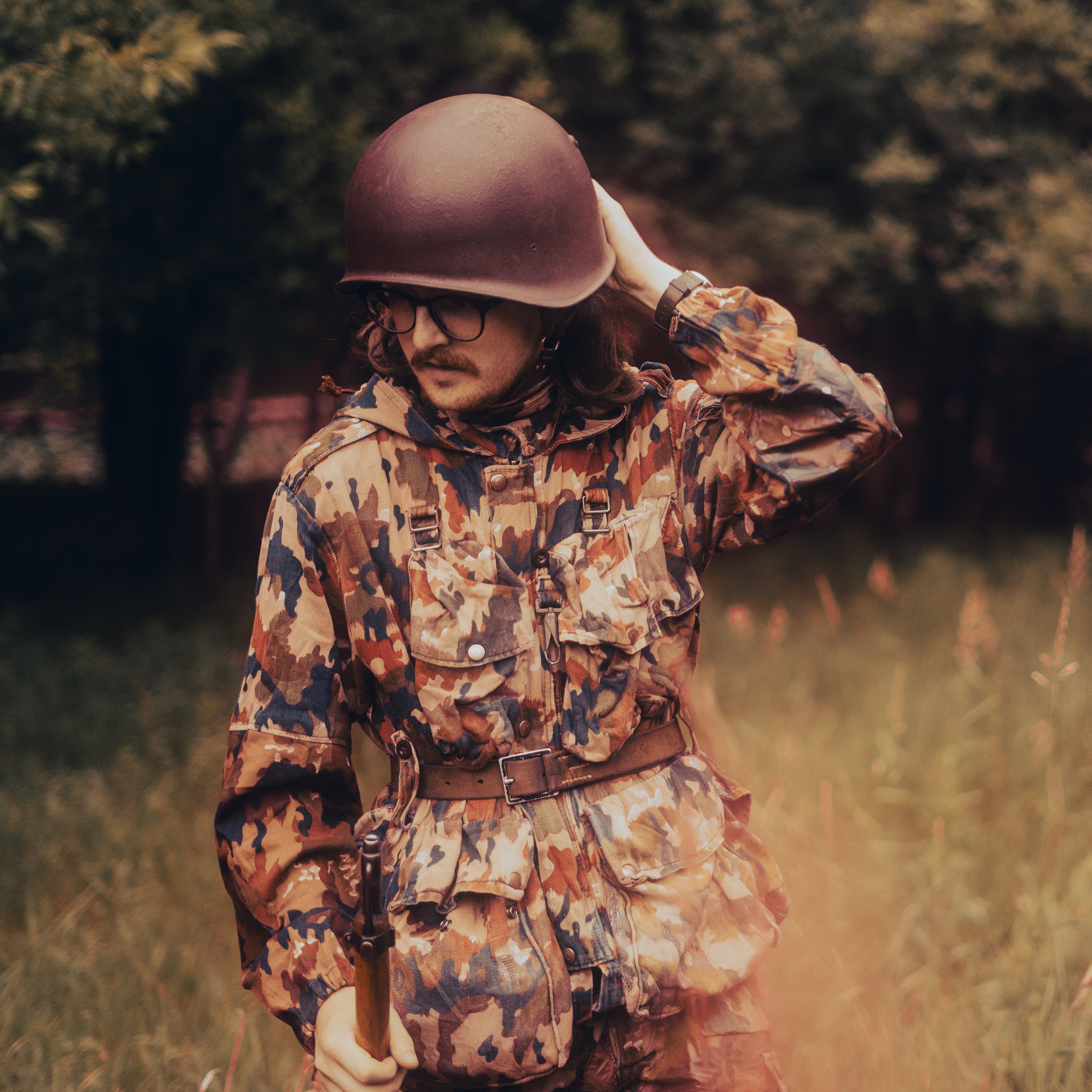 Helmeted man wearing TAZ 57 Alpenflage M61/70 Field Jacket