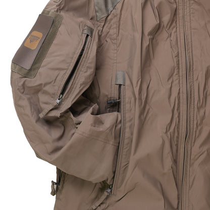 Close-up of a brown jacket with a patch on a white background
