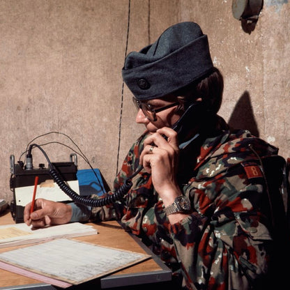 Soldier on the phone while wearing TAZ 57 Alpenflage M61/70 Field Jacket